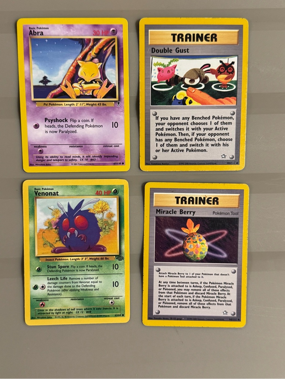 A collection of early Pokémon TCG cards from the 1990s and early 2000s. Set of 4